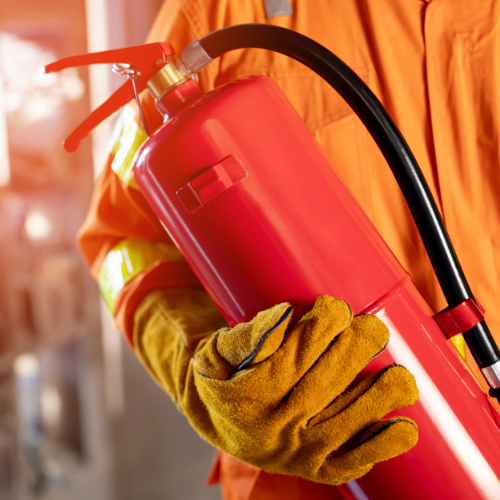 fireman holding fire extinguisher